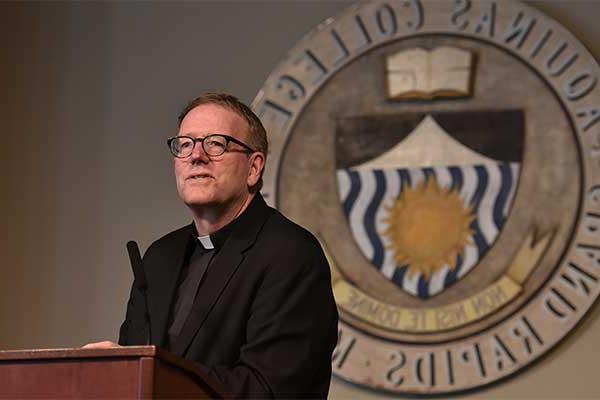 Speaker wearing clerical collar